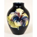 The Mitchell Collection of Moorcroft Pottery: A Moorcroft 'Hibiscus' pattern vase on cobalt blue