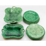 **WITHDRAWN** A collection of green majolica leaf plates, comport and trays, including Wedgwood