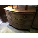 A George III mahogany bowfront chest of drawers, circa 1800, moulded top brushing slide, three