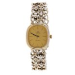 A silver gilt ladies Omega De Ville quartz watch, cream tone cushion shaped dial, approx 19mm,
