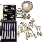 A group of table silver to include: George V five bar toast rack, by H&H, Birmingham, 1935,