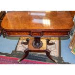A Regency mahogany fold-over tea table, rounded rectangular swivel top, above beaded panelled