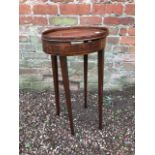 A George III oval mahogany lamp table, tray top, strung frieze, tapered block legs. width 33cm