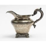 DERBY / POLICTICAL INTEREST: A Victorian silver presentation cream jug, ogee shaped on scroll