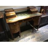 A late Victorian mahogany and strung Carlton house desk, circa 1890, of Sheraton revival design,