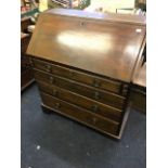 A George III mahogany bureau bookcase, the upper section with astragal glazed doors opening to