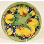 The Mitchell Collection of Moorcroft Pottery: A Moorcroft 'Leaf and Berry' pattern plate with a