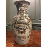 A Chinese crackle glaze baluster vase, early 20th Century, decorated with domestic objects on a