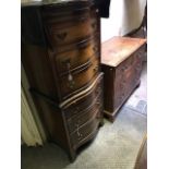 A Georgian style mahogany and walnut bowfront chest on chest, 20th Century, dentil cornice, the