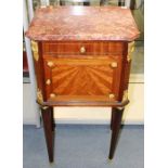 An early 20th Century French kingwood bedside cabinet, having a red marble top, the front fitted