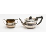 Asprey & Co: A George V part silver tea service to include teapot and sugar bowl, plain bodies,