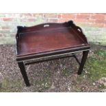 A traditional mahogany butlers tray top coffee table on stand, width 73cm