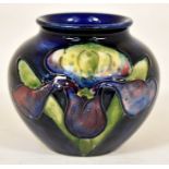 The Mitchell Collection of Moorcroft Pottery: A Moorcroft 'Orchid' pattern 55 shape vase on blue