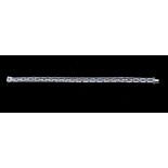 A diamond and sapphire 18ct white gold three row bracelet, comprising alternate claw set round cut