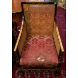 **WITHDRAWN** A pair of 19th century square back bergere armchairs, downswept arms, barley twist and