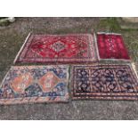Four assorted traditional oriental rugs (4)