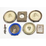 A group of silver to include: a late Victorian silver mounted watch mount, the cover applied with