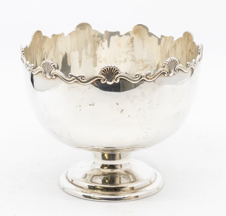 A George V silver rose bowl on stand, cast wavy rocaille and scroll border on raised foot, by Mappin