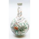 A Chinese famille verte bottle vase, Qing dynasty, 19th century, the rounded body painted with a