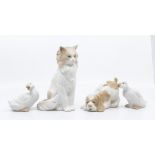 Four Nao figures of a cat, dog and to goslings