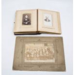 A Victorian leather bound photography album containing various portraits and another smaller,