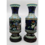 A pair of mid 20th Century cloisonne Chinese vases on stands, with birds of paradise detail