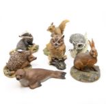 A group of Border Fine Arts animals, including a large falcon, squirrel, fawn, badger, hare,