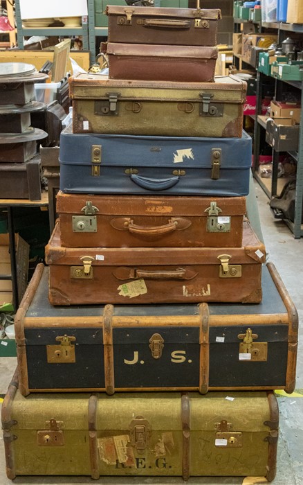 A collection of eight travel trunks and travel cases, leather, wood and vinyl examples