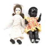 A black Pedigree doll, and a bisque head doll (2)