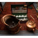 A Butler of Sheffield mahogany cased canteen of flatware; a copper kettle and coal scuttle (3)