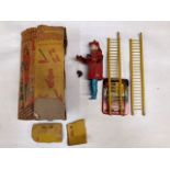 Marx Toys Climbing Fireman. Tinplate base and ladder with plastic clockwork fireman. Some damage,