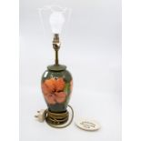 Late 20th Century green ground Moorcroft table lamp, no shade, along with Moorcroft collectors