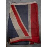 A first half 20th century Union Jack flag, approx 260cm x 127cm; and another Union Jack flag