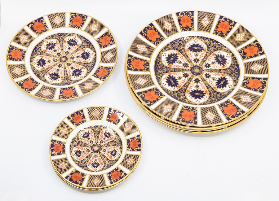 Four Royal Crown Derby 1128 pattern large plates, first quality with matching medium and two small