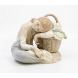 A Lladro figure of a girl leaning on a basket of cabbages Condition: repair of basket handle but not