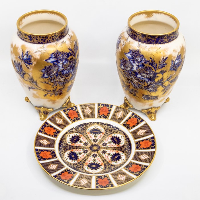 A pair of Carlton Ware ovoid vases, blue flowers with gilding, raised on four feet; and a Royal