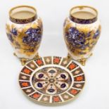 A pair of Carlton Ware ovoid vases, blue flowers with gilding, raised on four feet; and a Royal