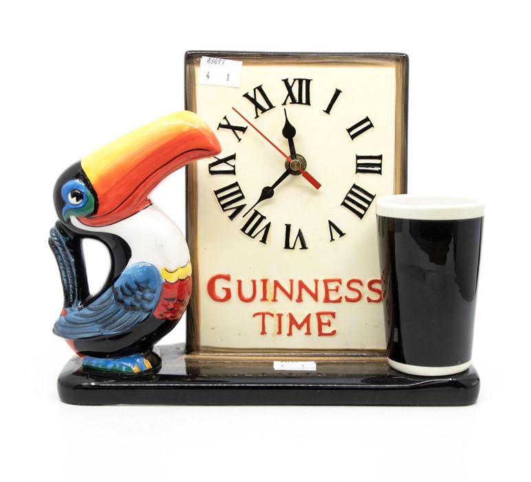 A late 20th Century Guinness Toucan clock, battery operated