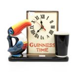 A late 20th Century Guinness Toucan clock, battery operated