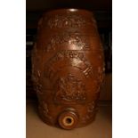 A stoneware wine barrel with applied Royal Arms, vine leaves and grapes, Knights, Lion passant