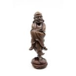 A late 19th Century Japanese rosewood carving of Bodhidharma, the Patriarch