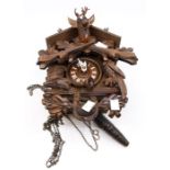 A contemporary Swiss carved cuckoo clock