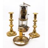 A pair of 19th century brass ejector candlesticks; a brass chamberstick and an Eccles Miners lamp,
