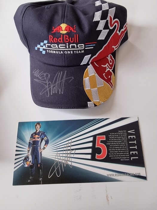 Red Bull F1 team cap, signed by Mark Webber and Sebastien Vettel. New. Provenance: Given to