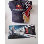 Red Bull F1 team cap, signed by Mark Webber and Sebastien Vettel. New. Provenance: Given to