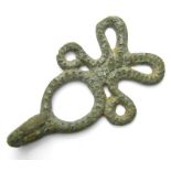 Large Strap Fastener.  Circa 17th century. Copper-alloy, 9.10 grams. 49.24 mm. An ornate large