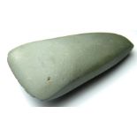 Neolithic polished greenstone axehead. A ground and polished Neolithic axehead c. 4000BC - 3000BC.