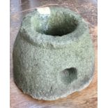 Stone, possibly a quern. approx 20cm high & 30cm wide  (at base)