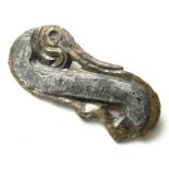 Anglo-Saxon Mythical Beast Mount.  Circa 6th century AD. Size: 37.83 mm. A copper-alloy mount with