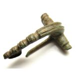 Roman Brooch.  Circa 2nd century AD. Copper-alloy, 6.83 grams. Size: 31.51 mm. A Dolphin type brooch